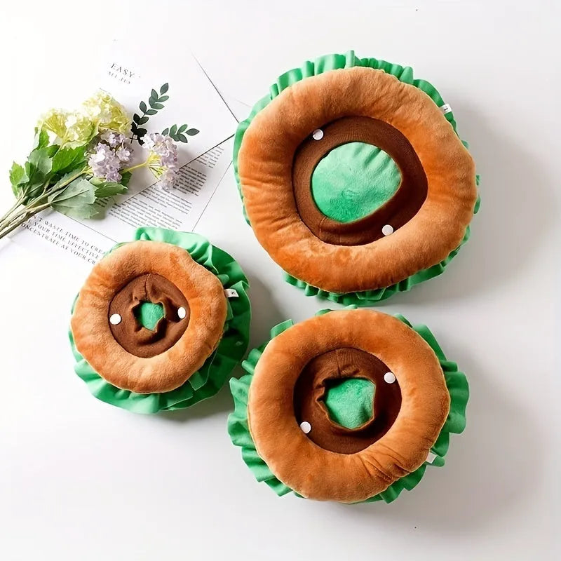 Brown, green, and beige burger-themed fabric headdress for cats on a white background.