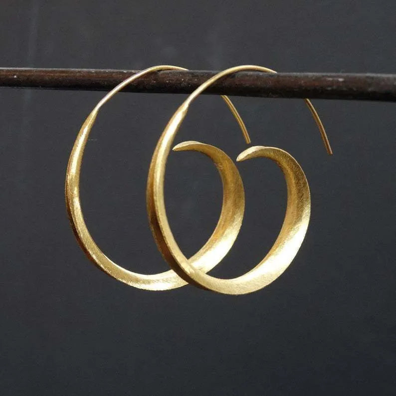 Round alloy ear studs with spiral leaf design in gold electroplated finish on white background