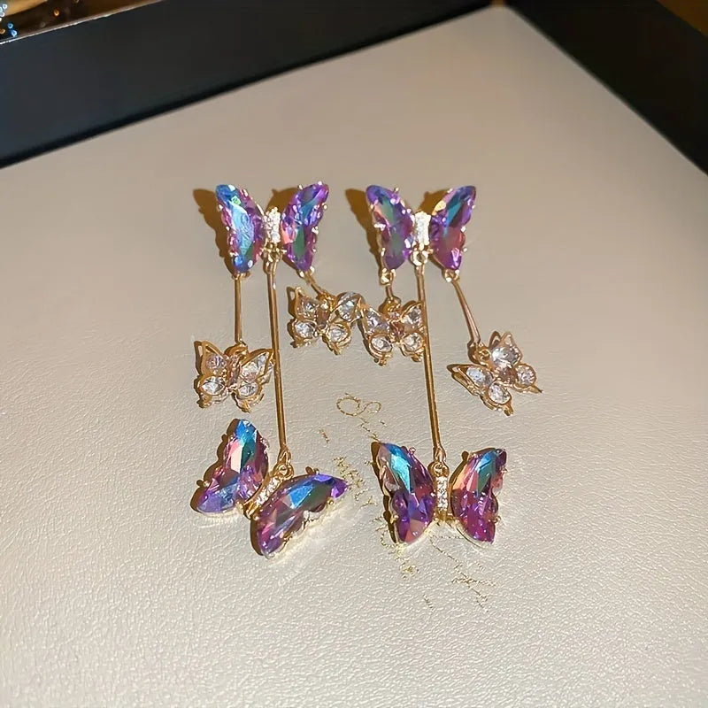 Electroplated blue purple butterfly tassel earrings with silver needle crystal flowers for women.