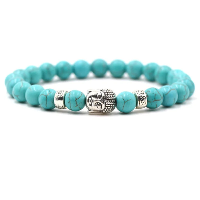 Tigereye stone Buddha head stretch bracelet with 8mm beads on a wrist.