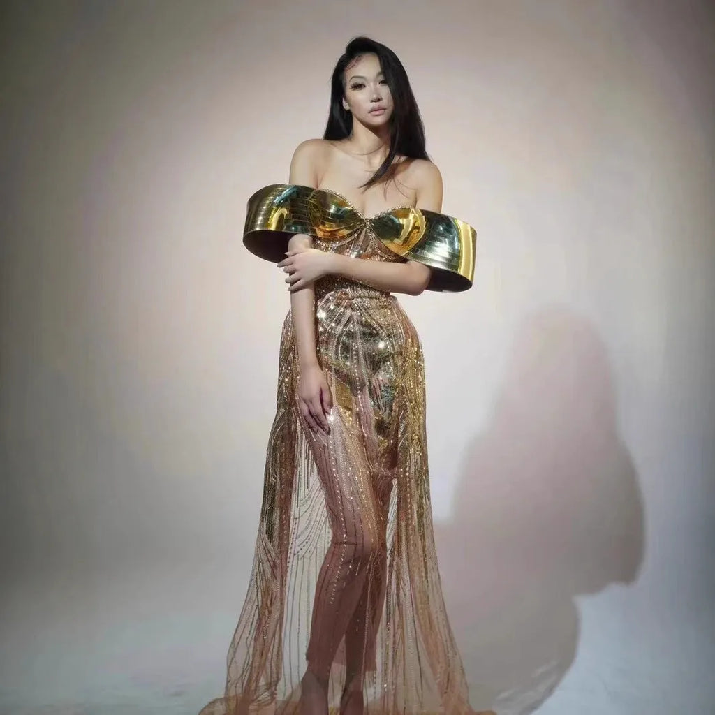 Gold sequined strapless long dress with a side split and tube top, shown on a model.