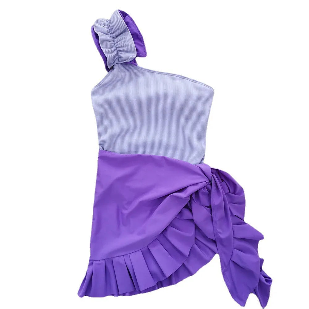 Women's single-shoulder suspender tube top one-piece swimsuit in a solid colour on a mannequin.