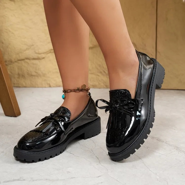 Women's black loafers with bow detail on artificial PU upper, flat sole design