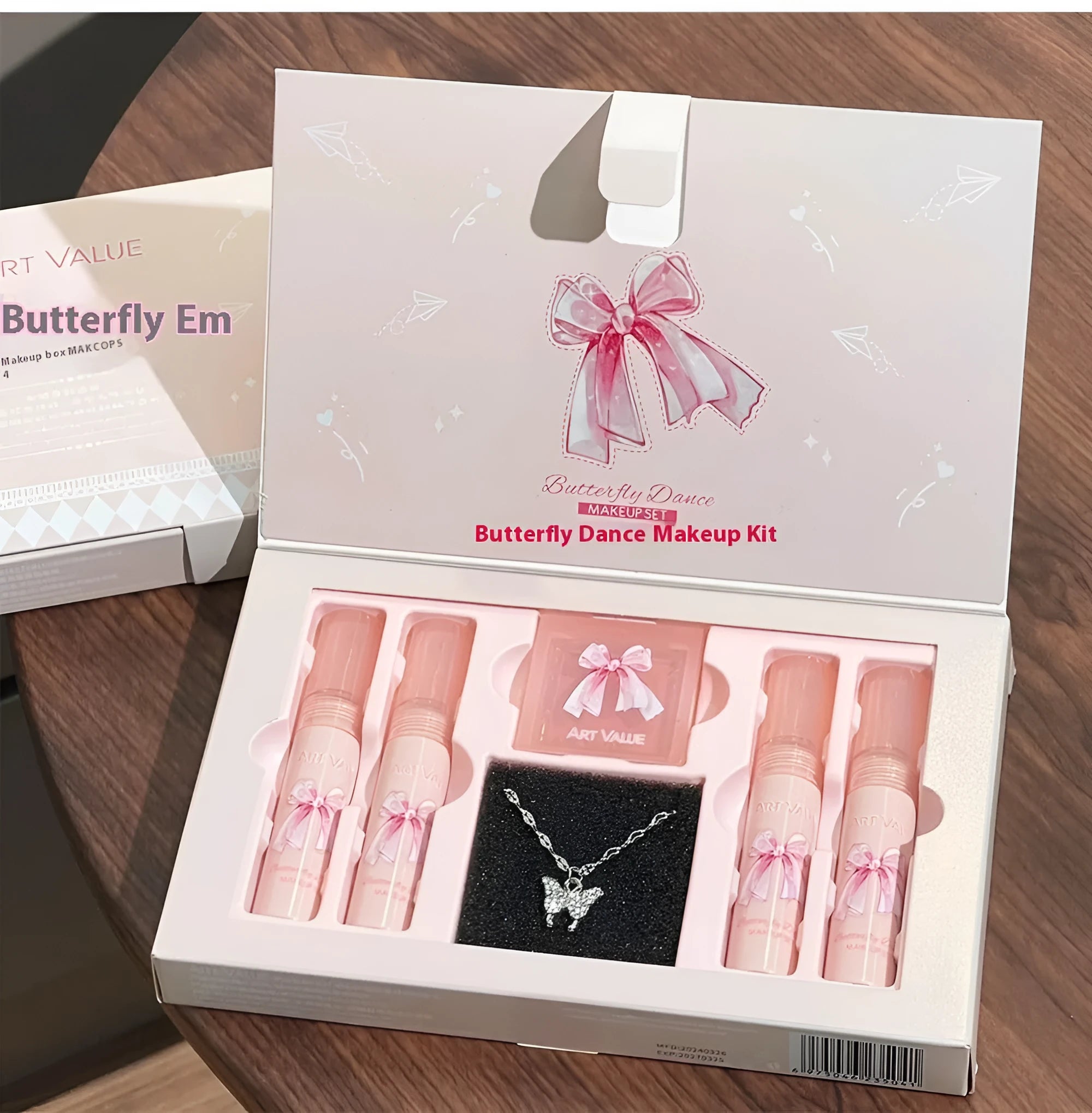 Butterfly Box makeup set showing four pink matte lip muds, powder blusher, and necklace