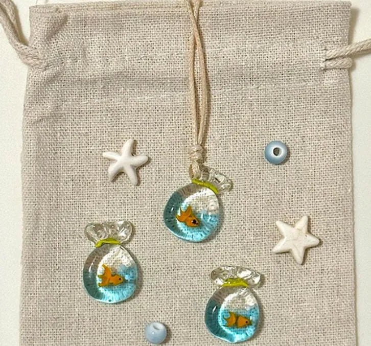 Women's pendant necklace with coloured glaze joker charm on cotton linen chain