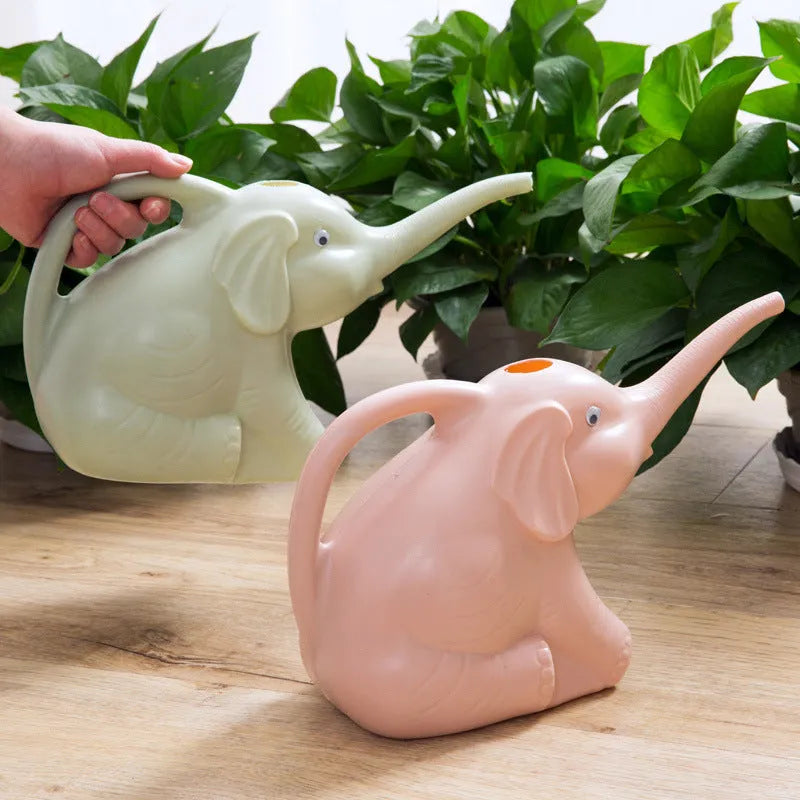 Pink baby elephant-shaped watering can with long nozzle and handle for child's hand