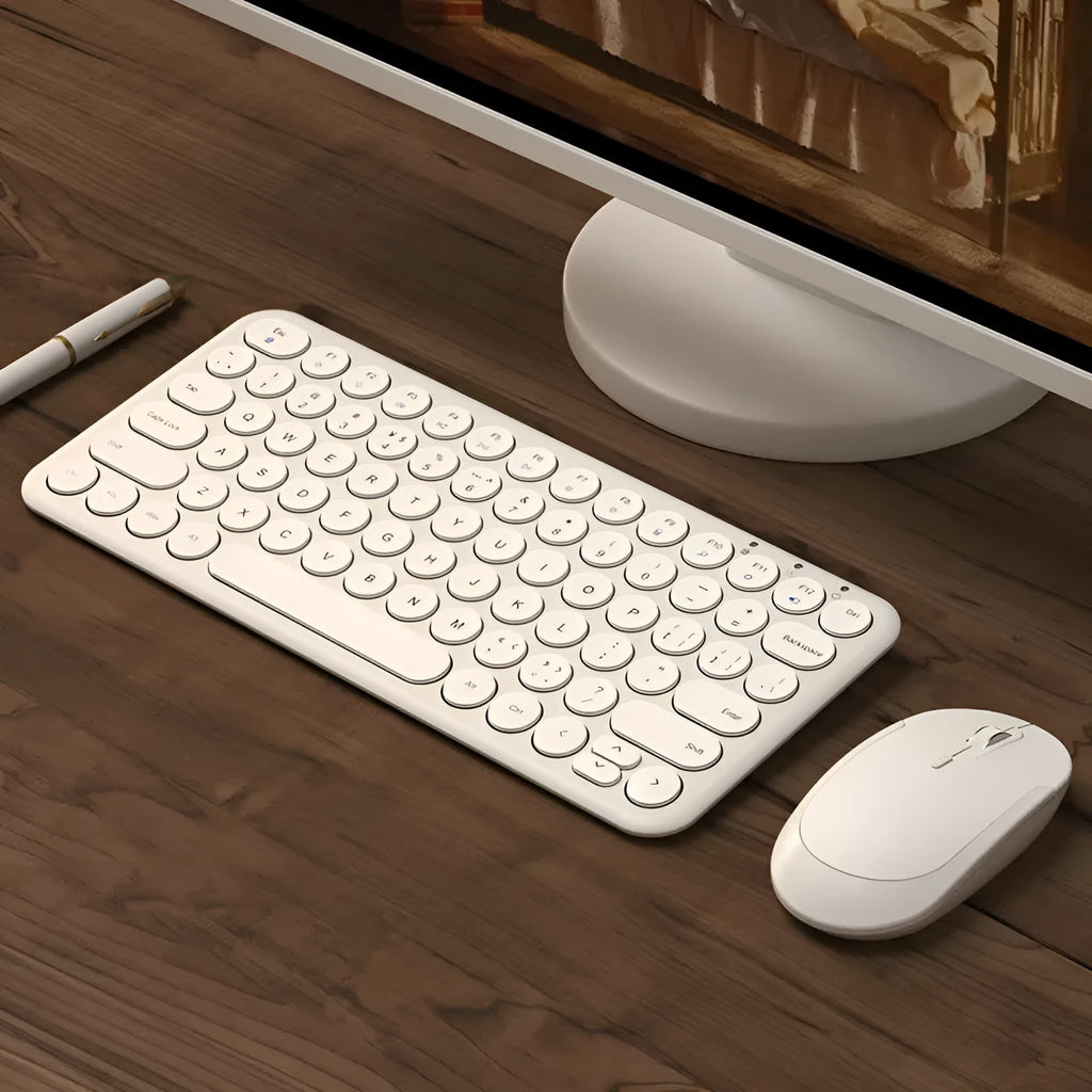 Ultra-thin wireless keyboard and optical mouse set on desk with USB receiver