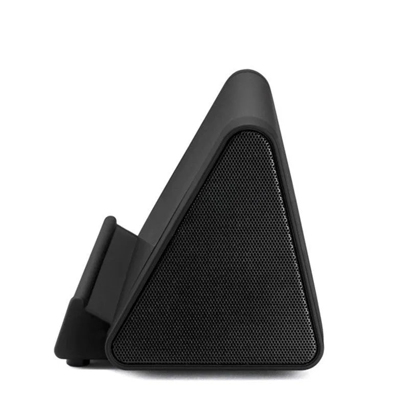 Compact black and white wireless Bluetooth speaker with rechargeable battery