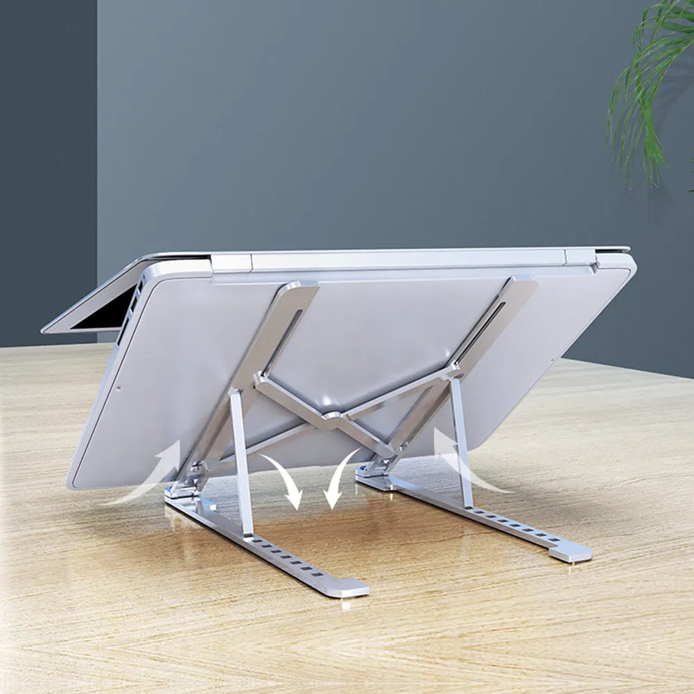 Portable foldable aluminum laptop stand shown in silver colour at an adjustable angle