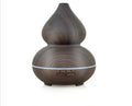 Ultrasonic aromatherapy humidifier 150ml wood grain perfume machine with dark wood finish on table