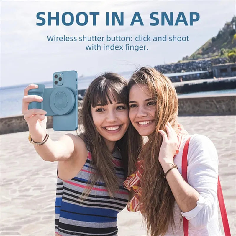 Black 3-in-1 magnetic phone camera holder with ergonomic handle on a wooden table.