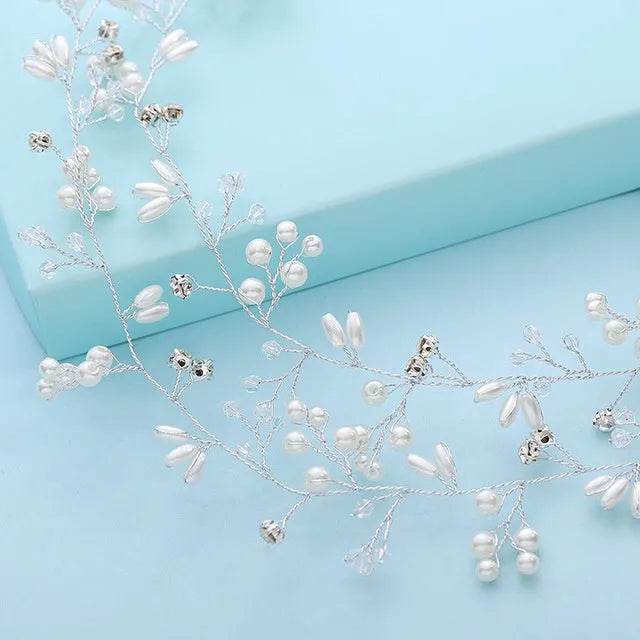 Silver wedding hair band with crystal and pearl decoration for long hair styling