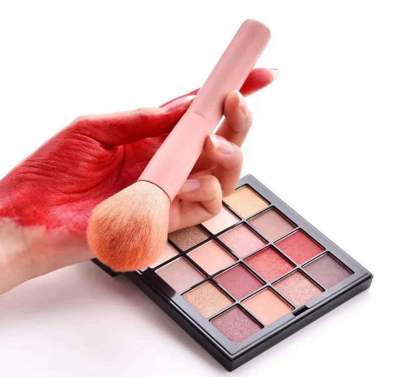 Ten makeup brushes with wooden handles including powder, foundation, and detail brushes for complete face application