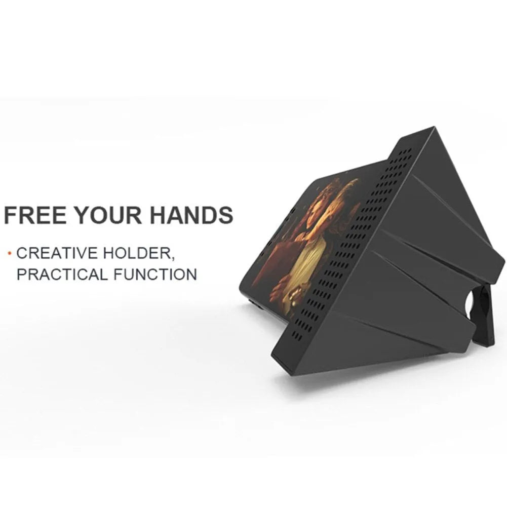 Portable black ABS plastic phone amplifier holder with an iPhone inserted, shown on a desktop.