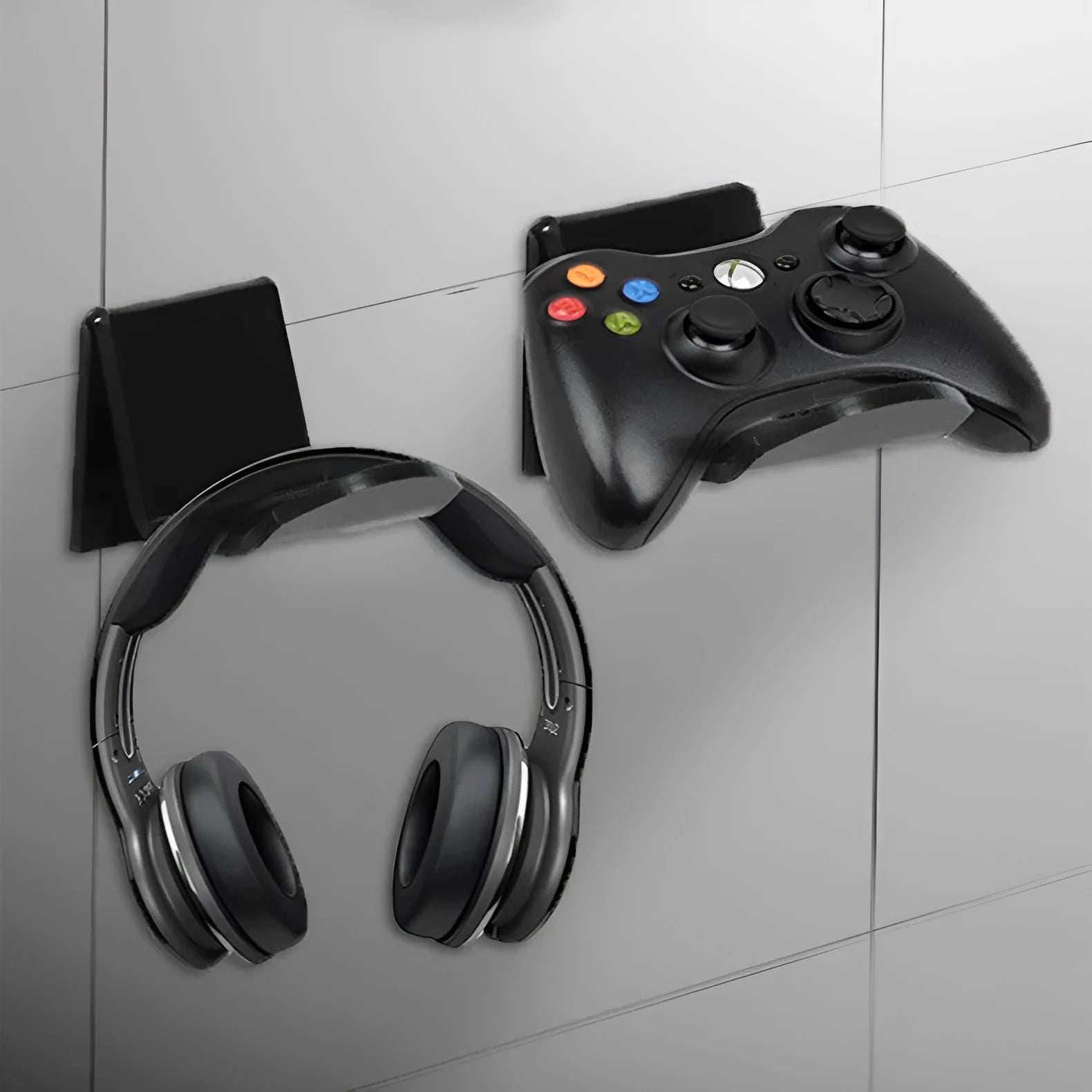 Universal game controller wall mount bracket shown in black, white, and transparent colours.