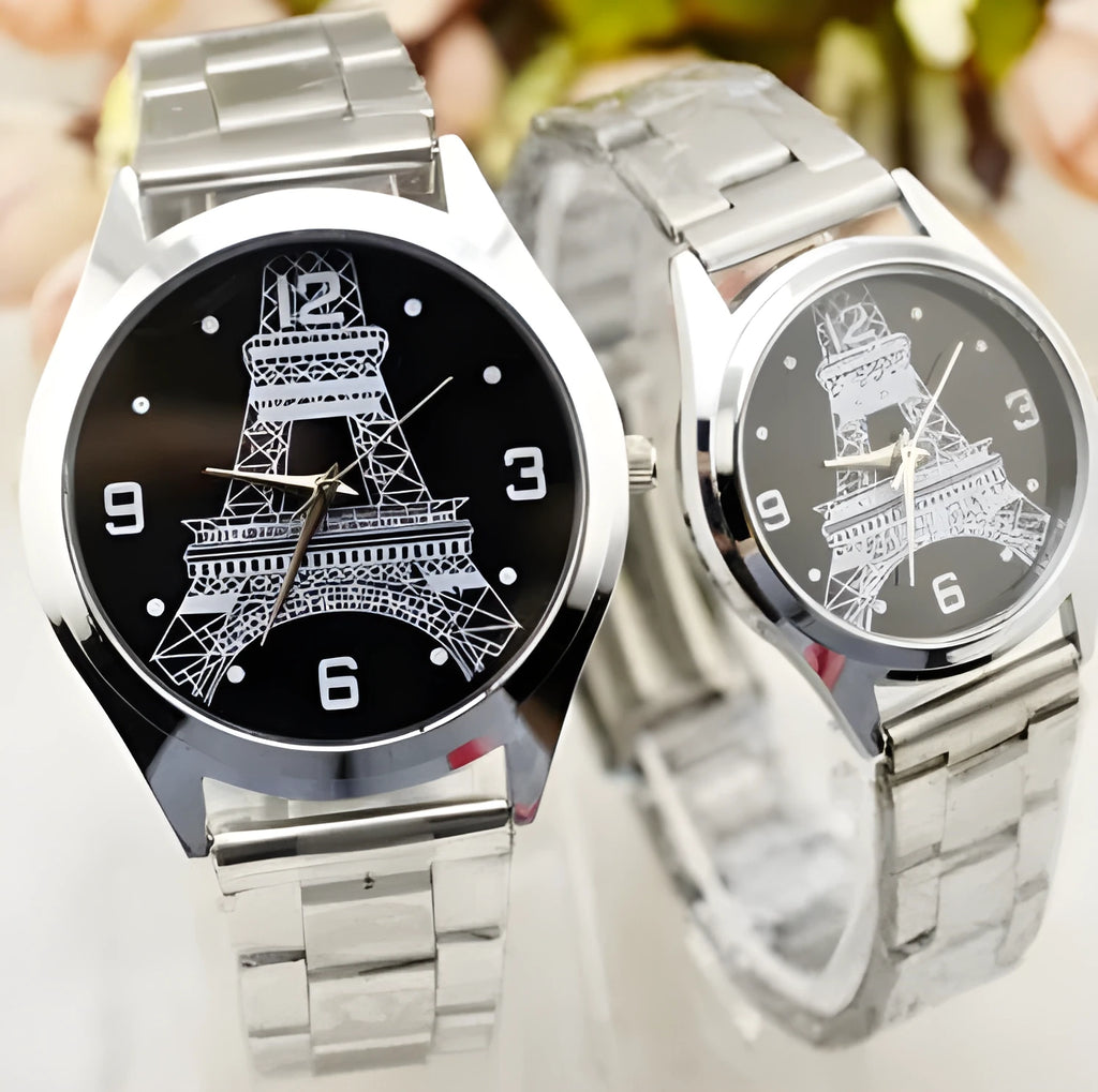 Silver-tone Eiffel Tower analogue wrist watch with black leather strap and roman numeral dial.