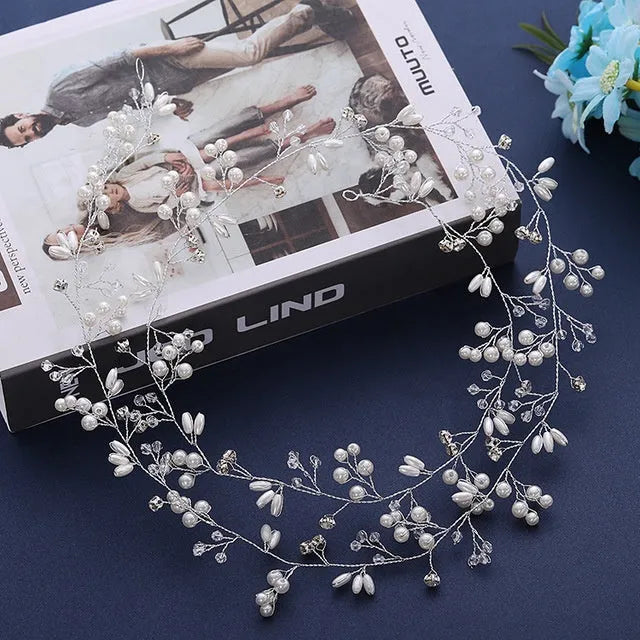 Silver wedding hair band with crystal and pearl decoration for long hair styling