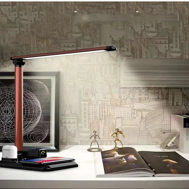Black and white 4-in-1 multifunction LED desk lamp with wireless charging pad and USB port.