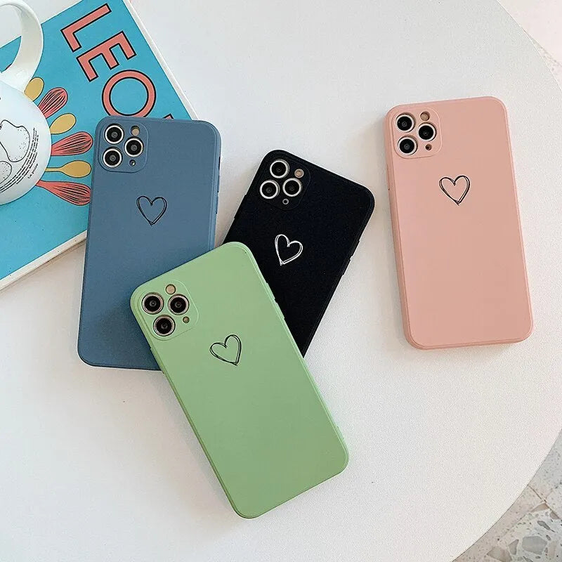Solid colour silicone TPU back cover case for Apple iPhone on a table.