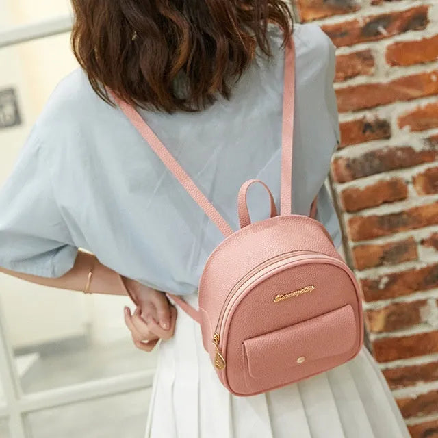 Women's small PU shoulder backpack 18.5cm length in black, blue, grey, pink, or red with zipper closure