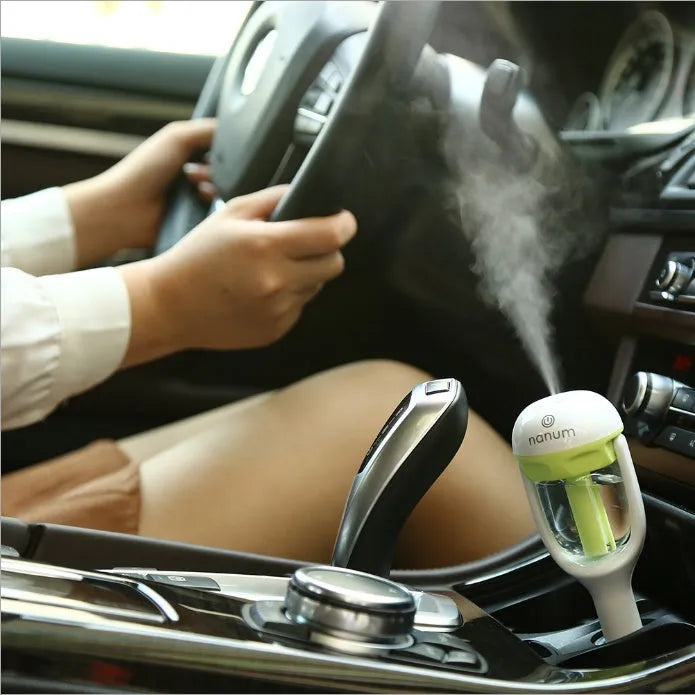 Portable car humidifier air purifier freshener with essential oil diffuser in compact travel design