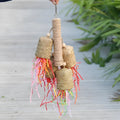 Colourful wooden parrot shredding toy with sisal fibre, measuring 15cm by 35cm.