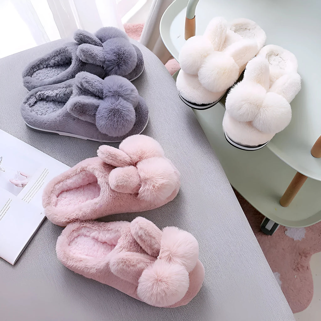 Women's bunny fluffy slippers in rabbit fur, shown in cream colour with floral detail and a sewn sole.