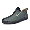 Men's black leather boots with front zipper and hand-stitched detailing on round toe