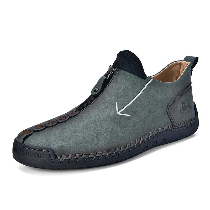 Men's black leather boots with front zipper and hand-stitched detailing on round toe