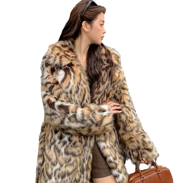 Women's faux fur coat with fox fur collar in street fashion style showing pockets and regular sleeves