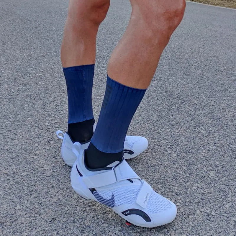 Athletic cycling socks in orange, black, purple, white, grey or dark blue with moisture-wicking fabric