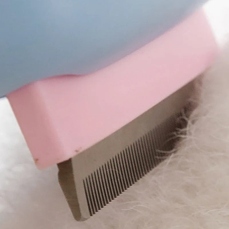 Red double-sided pet grooming brush with de-shedding rake and de-matting comb on a white background