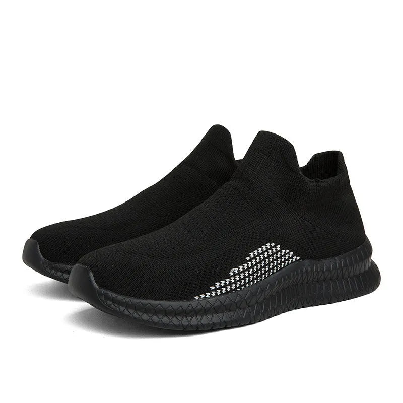 Men's black popcorn flyknit casual sneaker with fabric upper and round toe on a plain background.