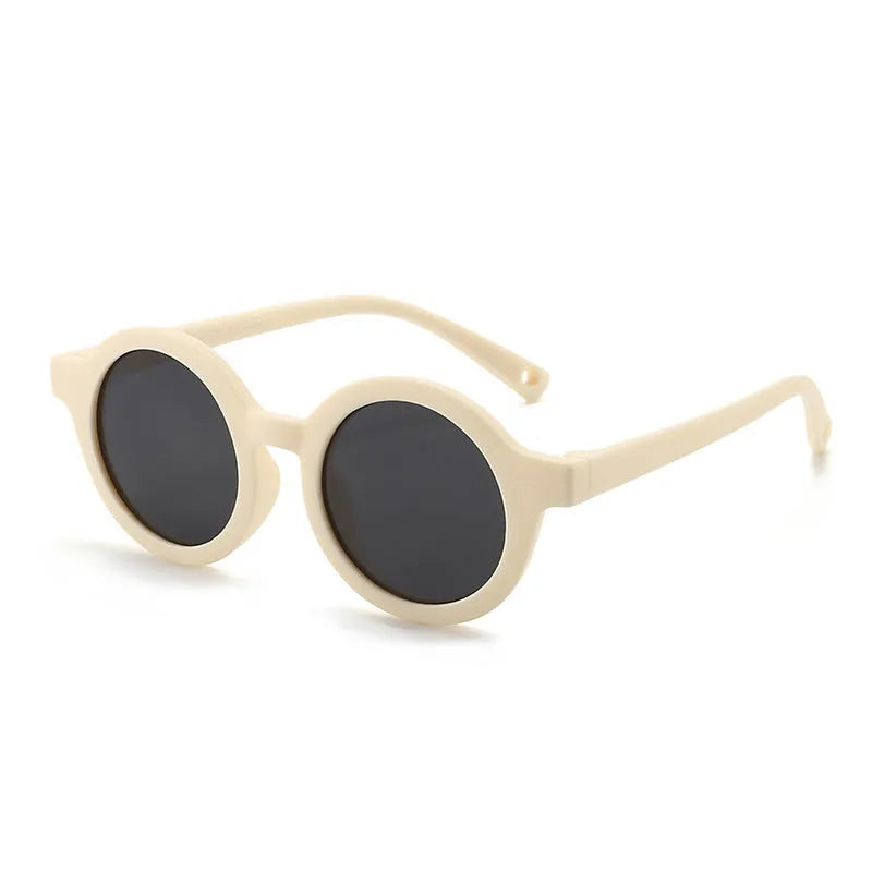 Round frame polarised sunglasses for toddlers aged 0-3 years with UV400 protection, shown in multiple colour options.