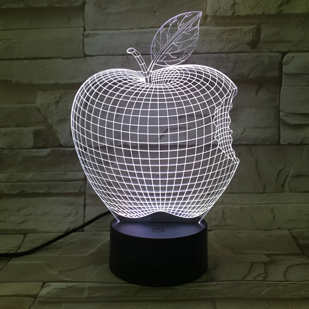 3D fruit-shaped night light with colourful LED glow and touch controls on a table.