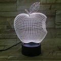 3D fruit-shaped night light with colourful LED glow and touch controls on a table.