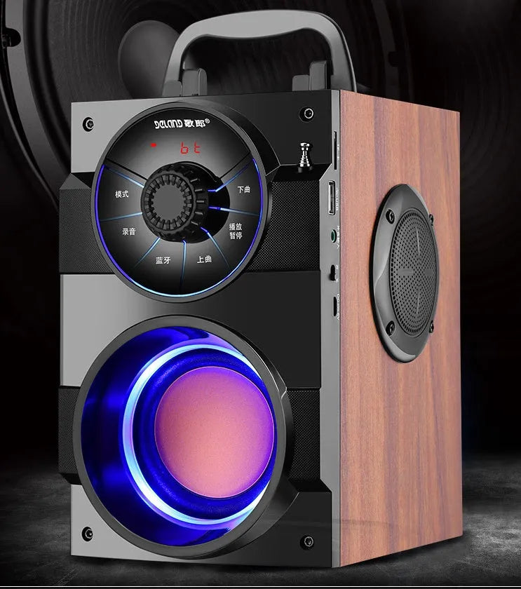 Black portable mini home audio system with subwoofer, 3.5mm audio cable, and USB charging cable.