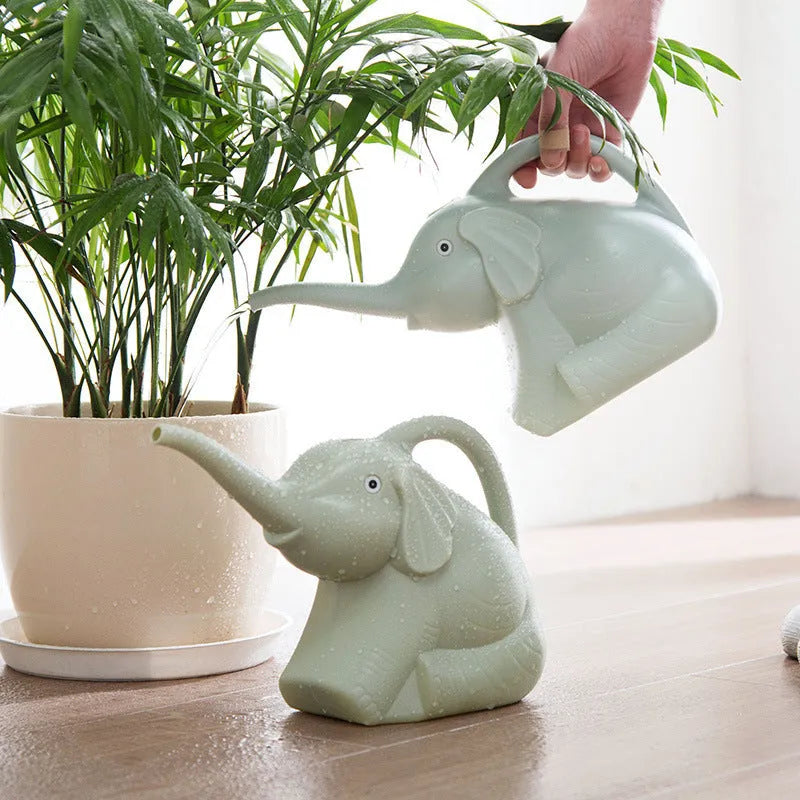 Pink baby elephant-shaped watering can with long nozzle and handle for child's hand