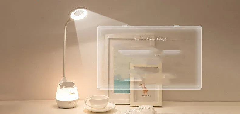 Green rechargeable touch table lamp with USB port on a wooden desk.