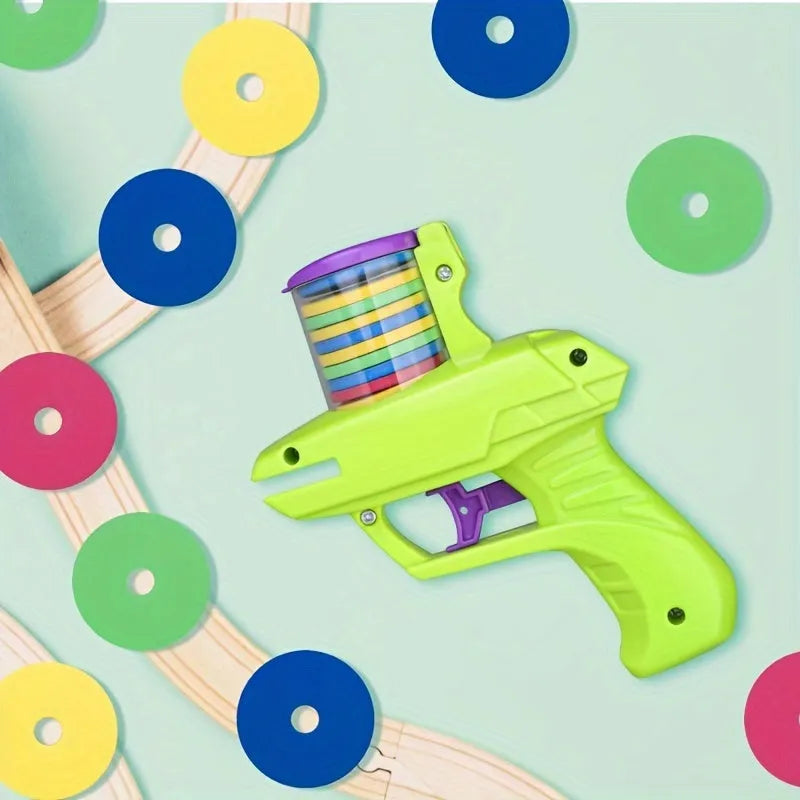 Green or purple battery-free cat toy launcher with foam disc and three foam balls