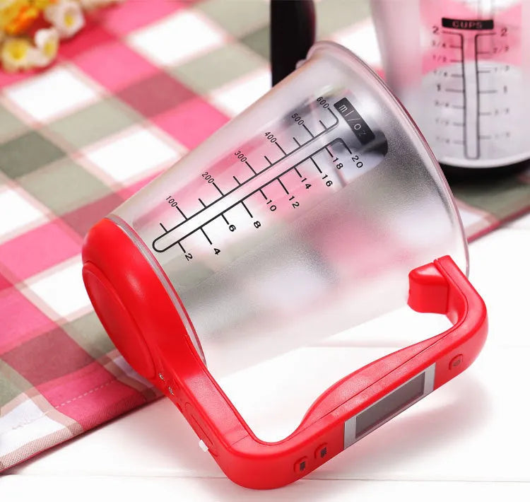 Digital kitchen scale measuring cup in green with LCD display on handle showing weight