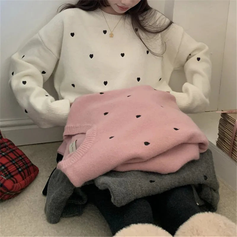 Women's loose fit acrylic pullover sweater with crew neck and embroidery details