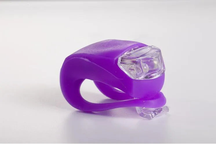 LED bike safety light with flexible silicone body and clip-on attachment in multiple colours