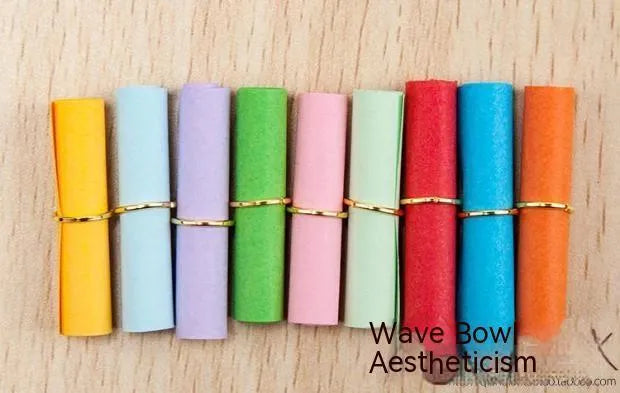 Assorted colour mini paper scrolls with metal eyelets in sizes 5x5cm, 3x7cm, 4x7cm, and 7x7cm for drift bottle messages.