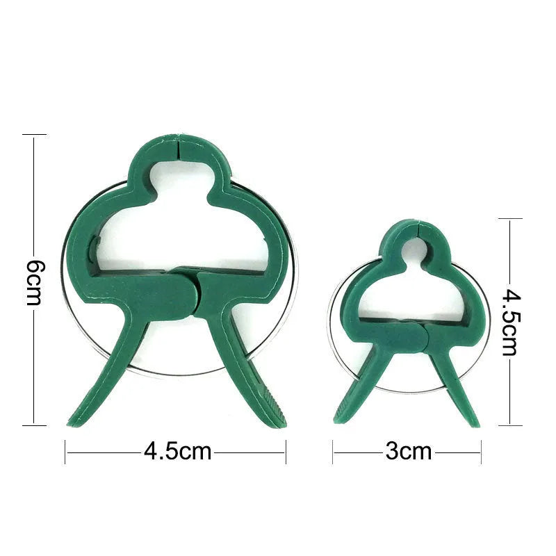 Set of green plastic plant fixing clips with zinc springs, showing large and small sizes for garden use.