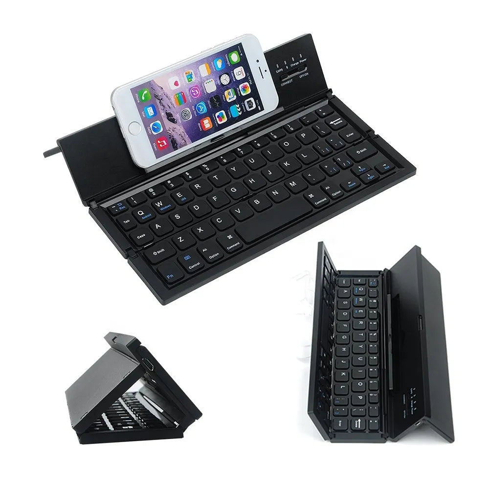 Mini folding ultra-thin wireless Bluetooth keyboard in black, open and ready for typing with a tablet