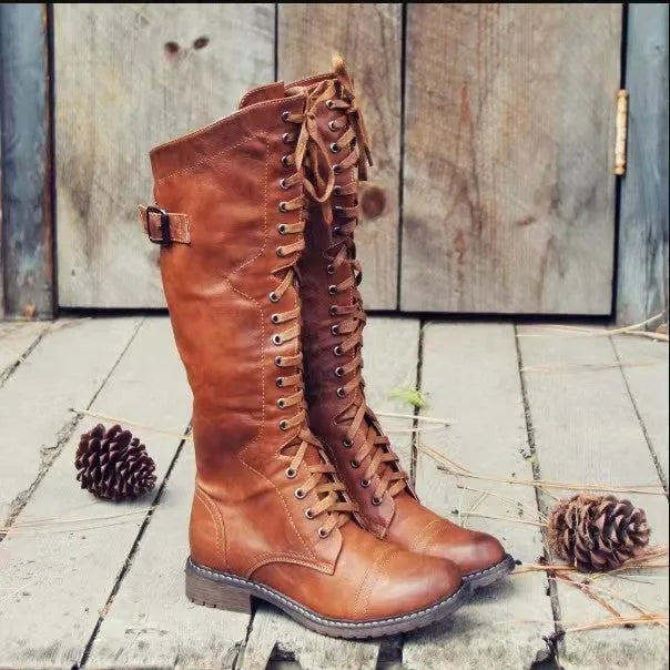 Women's black chunky heel high-leg casual boots with a round toe and rubber sole.