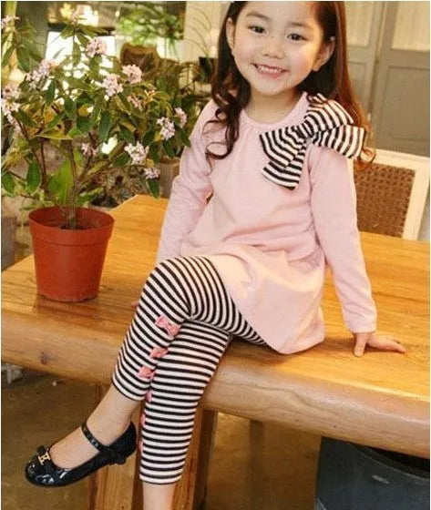 Girl's pink cotton clothing set with long sleeve top and trousers in children's sizes