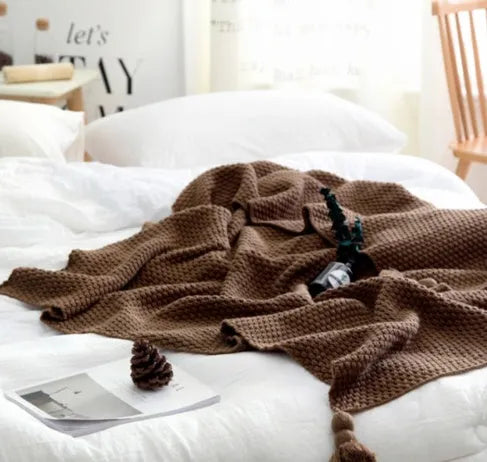 Acrylic knit ball blanket in beige colour, measuring 130 by 170 centimetres, laid flat.