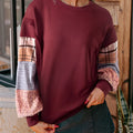Women's loose fit long sleeve top with plaid stripe pattern stitching in apricot colour